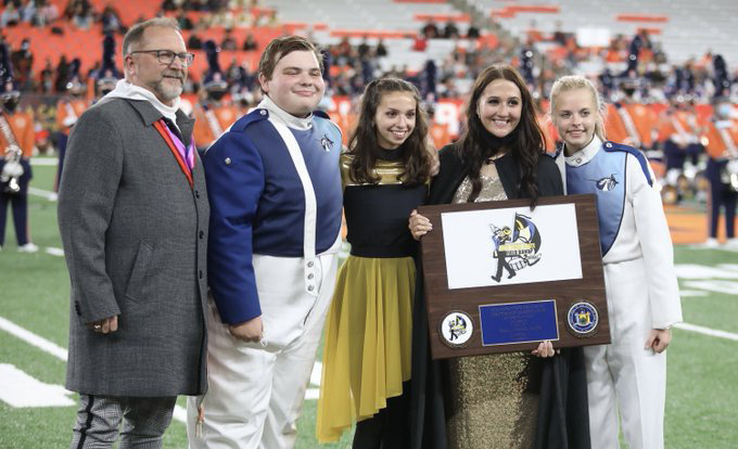 Picture of Marching band members holding award