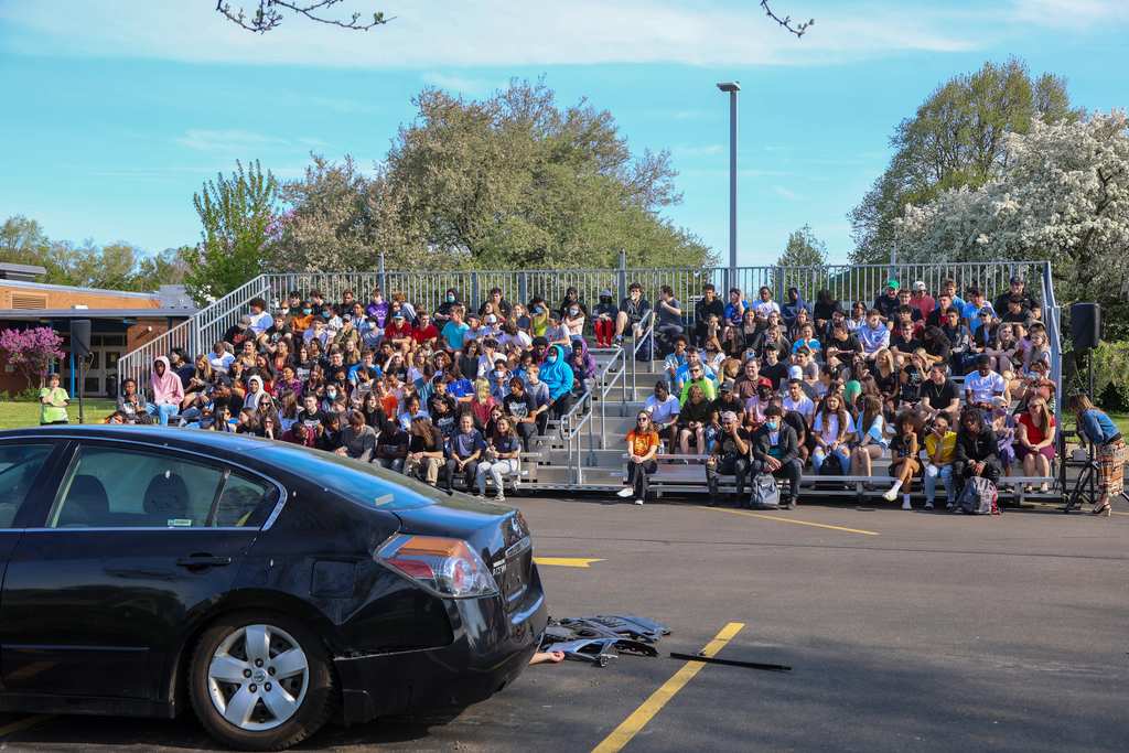 EHS and Bishop Kearney students watching distracted driving reenactment