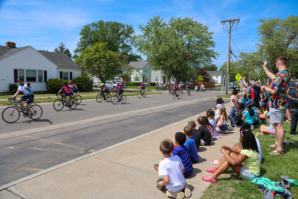 students watching cyclists