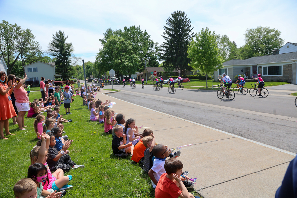 students watching cyclists