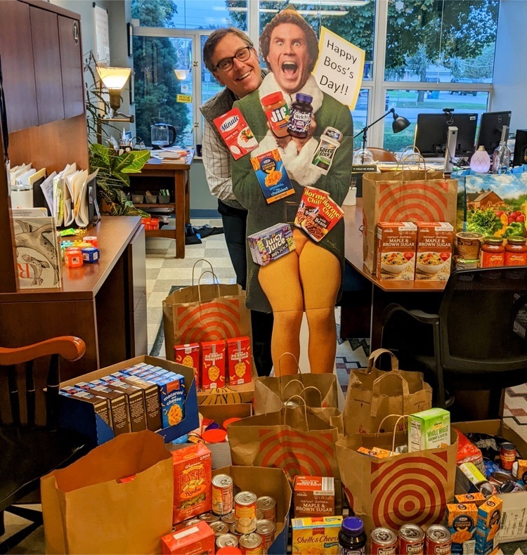picture of Dr. Hiley with food donations