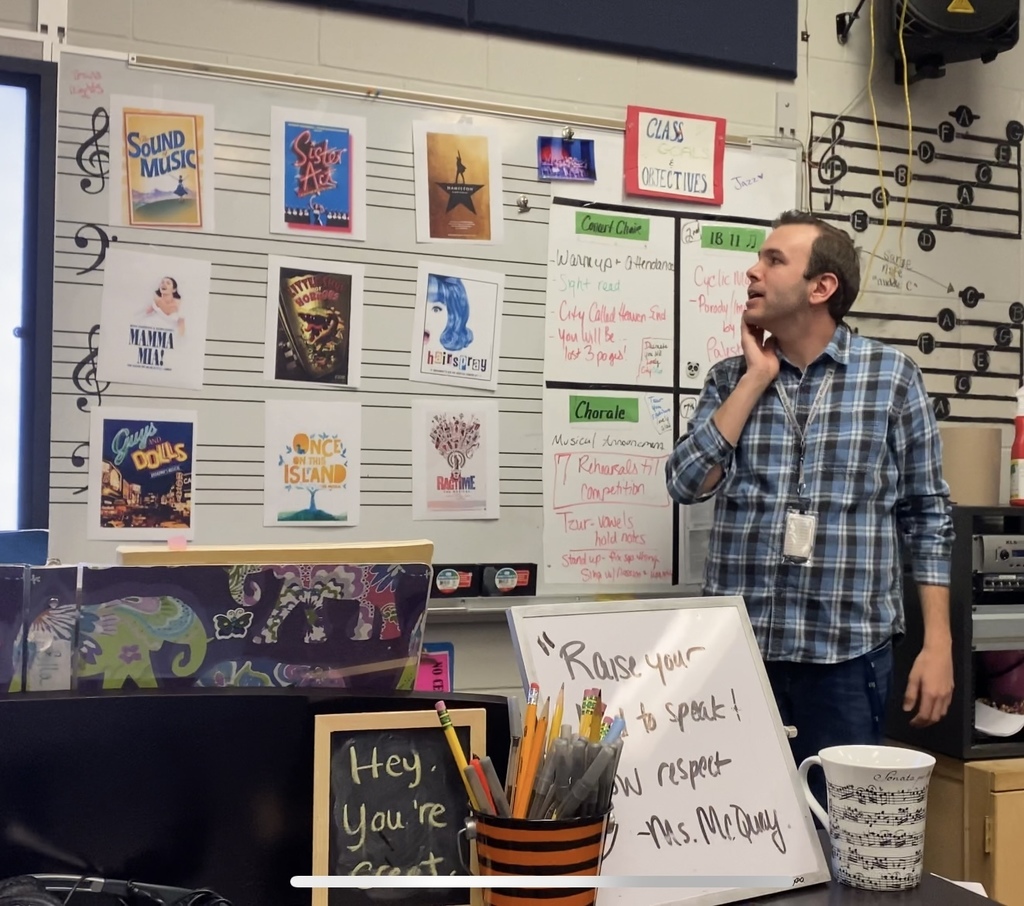 Mr. Lachance-Tofany looking at the musical posters