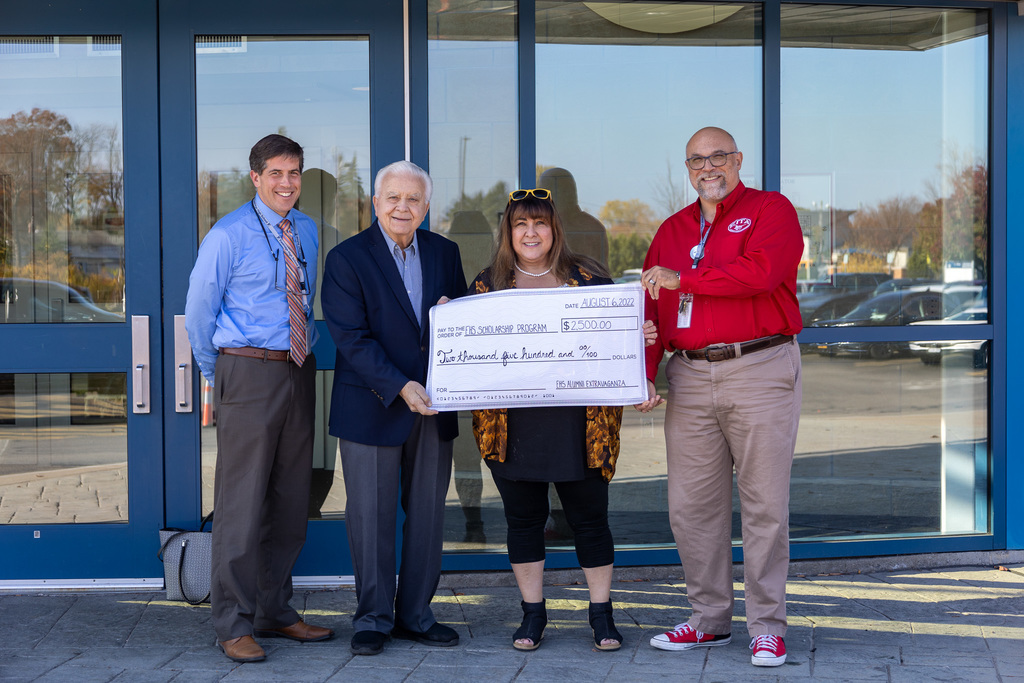 Presentation of Alumni donation (From left to right) Mr. Heaphy, Mr. Powers, Ms. Naomi, and Mr. McMurry