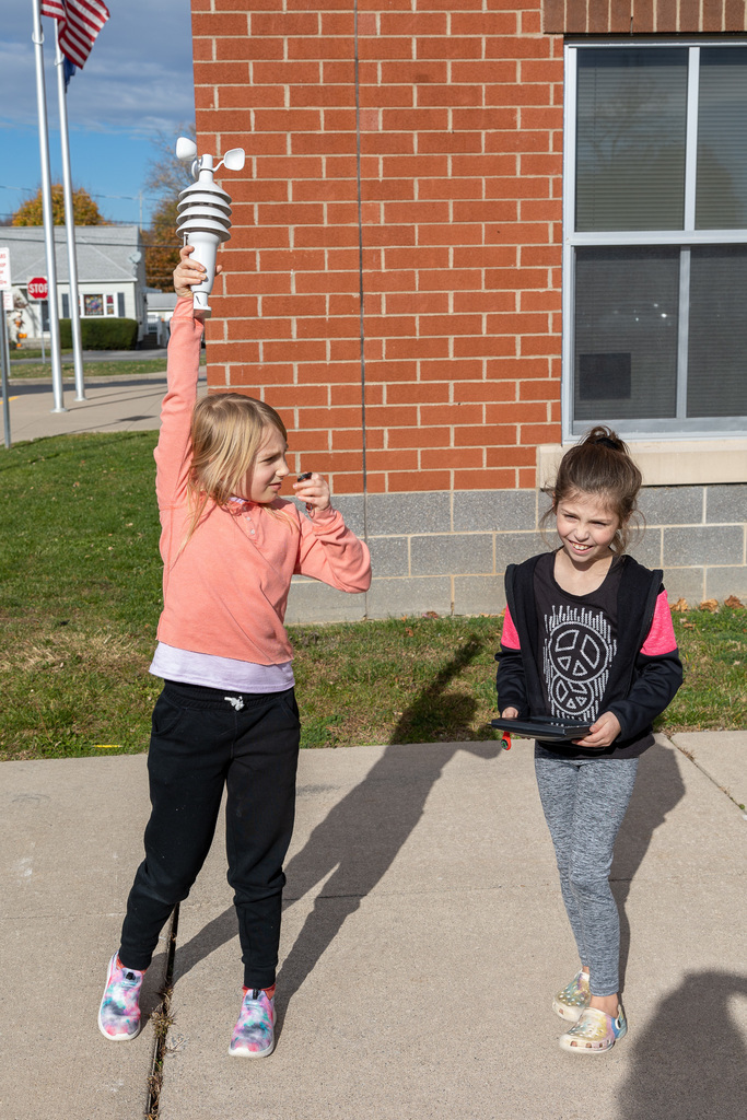 Students measuring weather