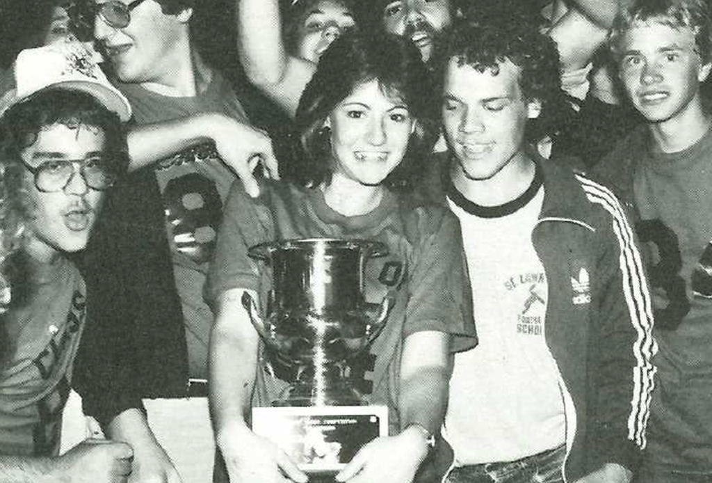 students hold a trophy during hoopla week in 1984