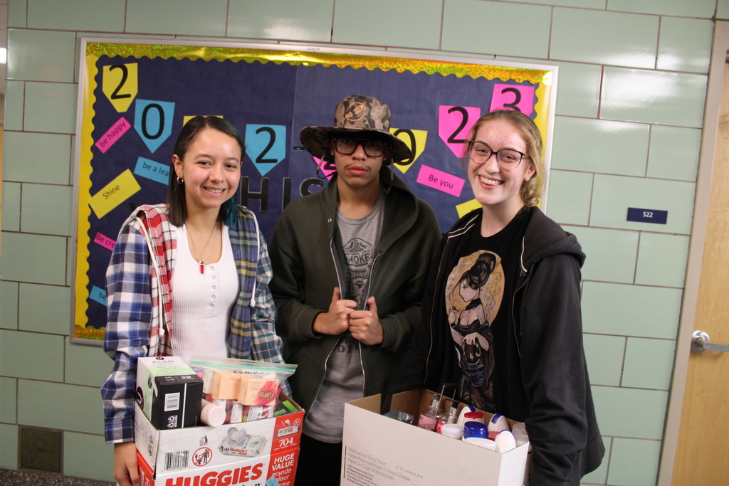 student council members with donations in hand