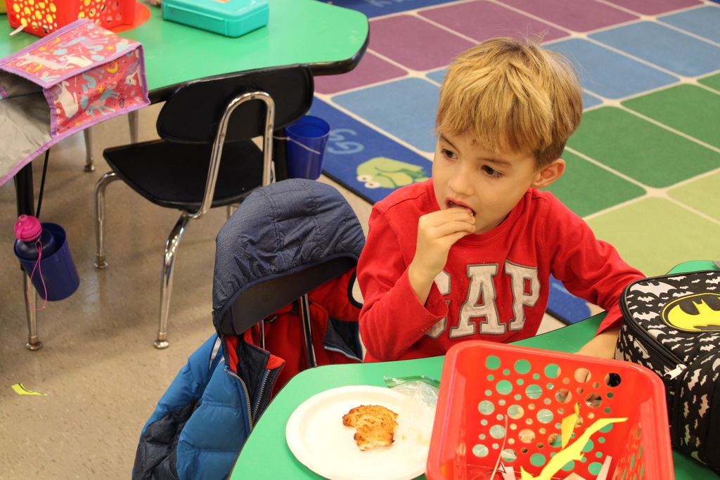 student eating latkes 