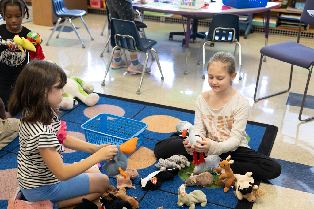 2nd graders playing with stuffed animals